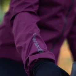 Carnac Women's Burgundy Waterproof Cycling Rain Jacket -Planetx Shop Close up sleeve